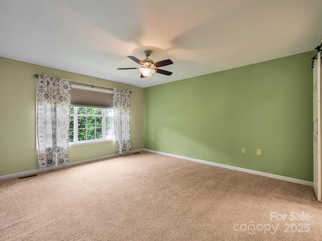 621 E Park Pl, Hendersonville, NC 28791 - carpeted empty room with a ceiling fan and baseboards