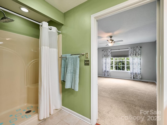 621 E Park Pl, Hendersonville, NC 28791 - full bath featuring a shower with shower curtain, a ceiling fan, and tile patterned floors