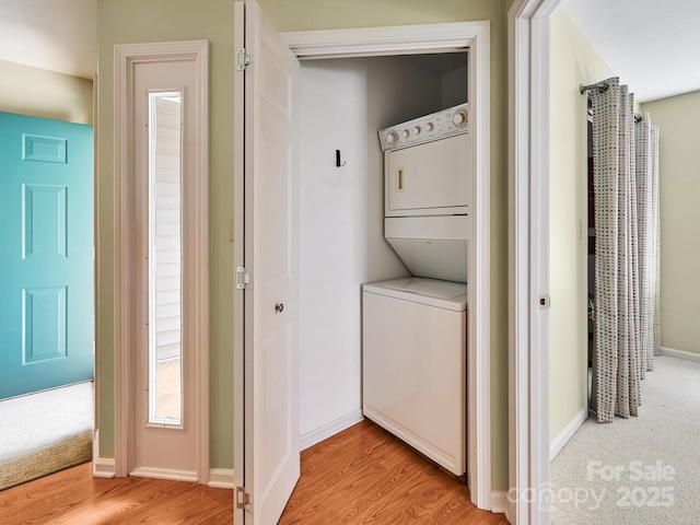 621 E Park Pl, Hendersonville, NC 28791 - laundry room featuring stacked washing machine and dryer and light wood-style flooring