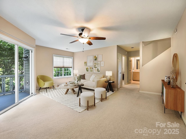 621 E Park Pl, Hendersonville, NC 28791 - carpeted living room with ceiling fan and baseboards