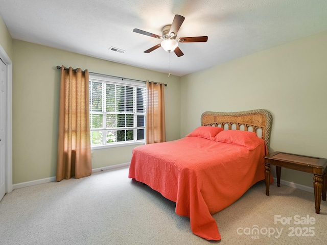 621 E Park Pl, Hendersonville, NC 28791 - carpeted bedroom with baseboards and ceiling fan