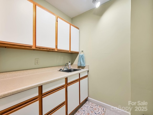 621 E Park Pl, Hendersonville, NC 28791 - kitchen with light countertops and white cabinets