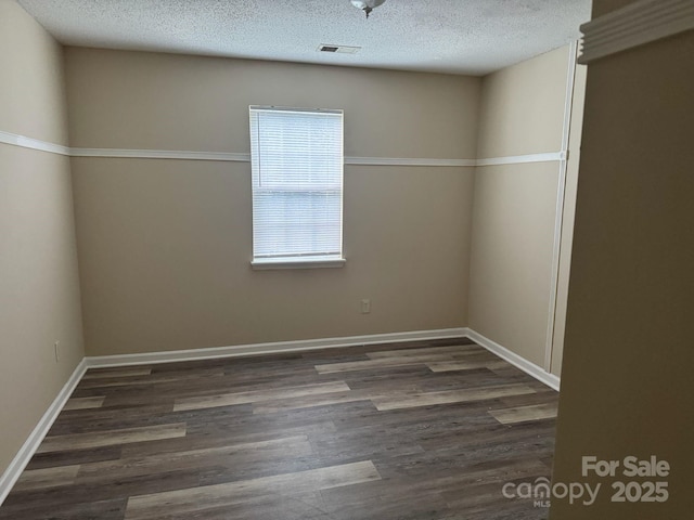 1814 Birch Heights Ct, Charlotte, NC 28213 - empty room featuring wood finished floors and a textured ceiling