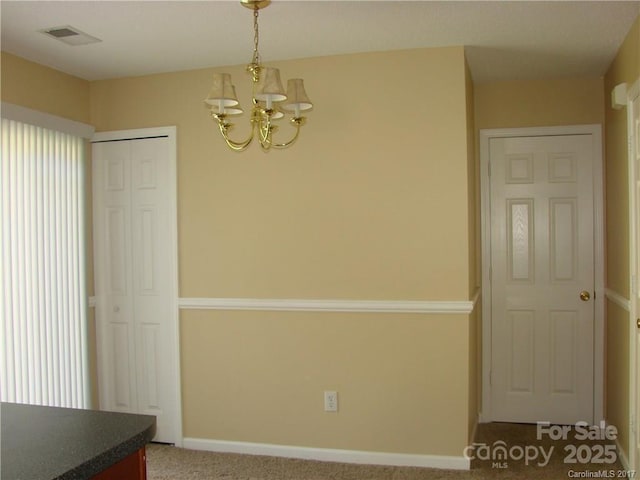 1814 Birch Heights Ct, Charlotte, NC 28213 - unfurnished dining area featuring a chandelier and carpet