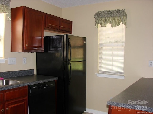 1814 Birch Heights Ct, Charlotte, NC 28213 - kitchen featuring black appliances, dark brown cabinets, and dark countertops