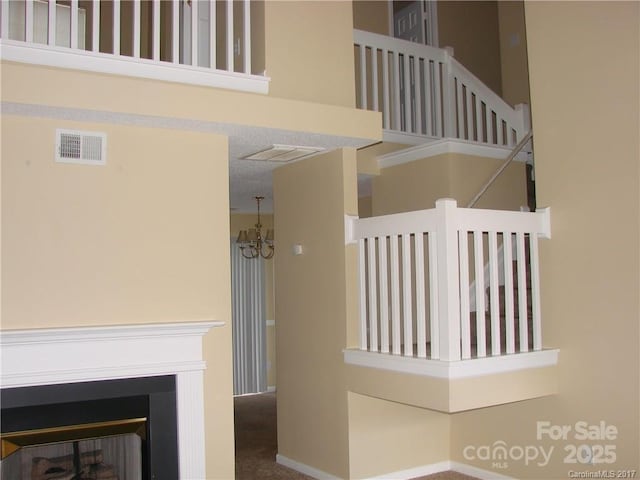 1814 Birch Heights Ct, Charlotte, NC 28213 - stairway with a chandelier
