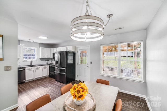 5116 Crane Point Dr, Charlotte, NC 28227 - dining room featuring baseboards and dark wood-type flooring