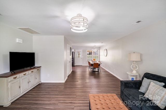 5116 Crane Point Dr, Charlotte, NC 28227 - living area featuring dark wood-type flooring and a chandelier