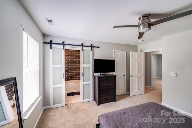 5116 Crane Point Dr, Charlotte, NC 28227 - unfurnished bedroom featuring multiple windows, carpet floors, a barn door, and a ceiling fan
