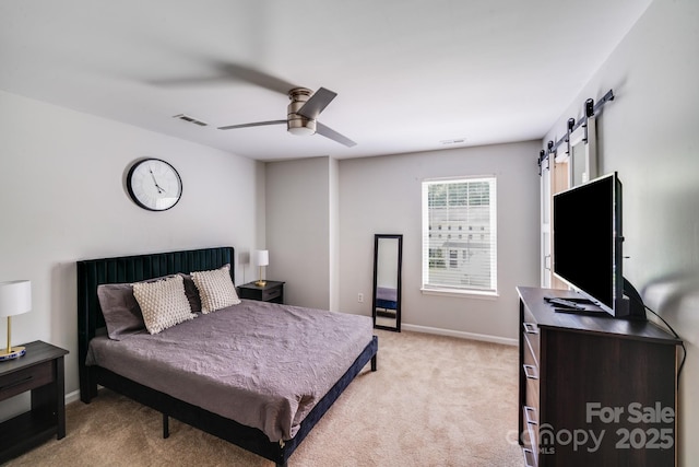 5116 Crane Point Dr, Charlotte, NC 28227 - bedroom featuring a barn door, light carpet, and ceiling fan