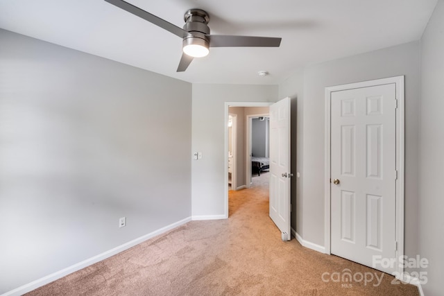 5116 Crane Point Dr, Charlotte, NC 28227 - unfurnished bedroom with light colored carpet and a ceiling fan