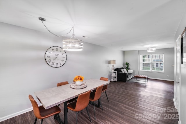 5116 Crane Point Dr, Charlotte, NC 28227 - dining space featuring a chandelier and dark wood-type flooring