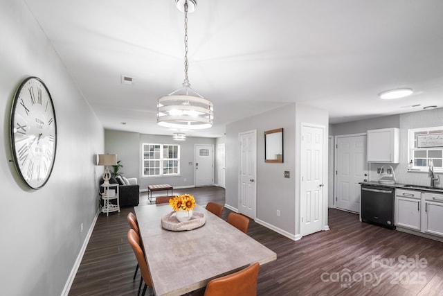 5116 Crane Point Dr, Charlotte, NC 28227 - dining room with dark wood-style flooring and a chandelier