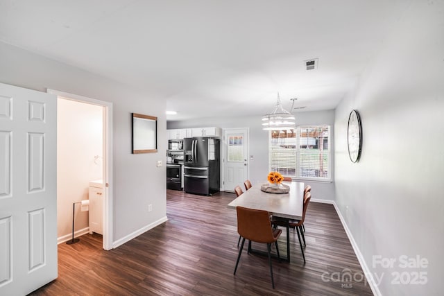 5116 Crane Point Dr, Charlotte, NC 28227 - dining area featuring dark wood finished floors and a chandelier