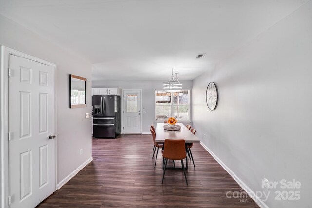 5116 Crane Point Dr, Charlotte, NC 28227 - dining space featuring plenty of natural light, dark wood-type flooring, and a chandelier