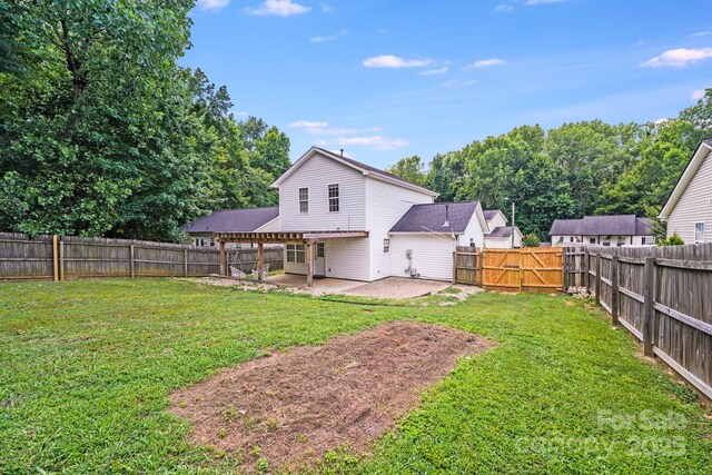5116 Crane Point Dr, Charlotte, NC 28227 - back of house featuring a patio area, a fenced backyard, and a gate