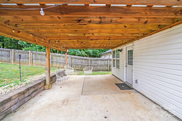 5116 Crane Point Dr, Charlotte, NC 28227 - fenced backyard featuring a patio area