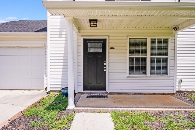 5116 Crane Point Dr, Charlotte, NC 28227 - property entrance featuring a garage and a porch