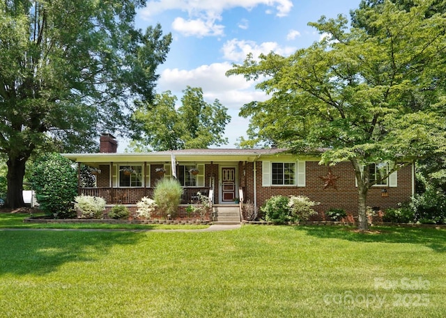 1104 Pump Station Rd, Kannapolis, NC 28081 - single story home with covered porch, a chimney, a front lawn, and brick siding