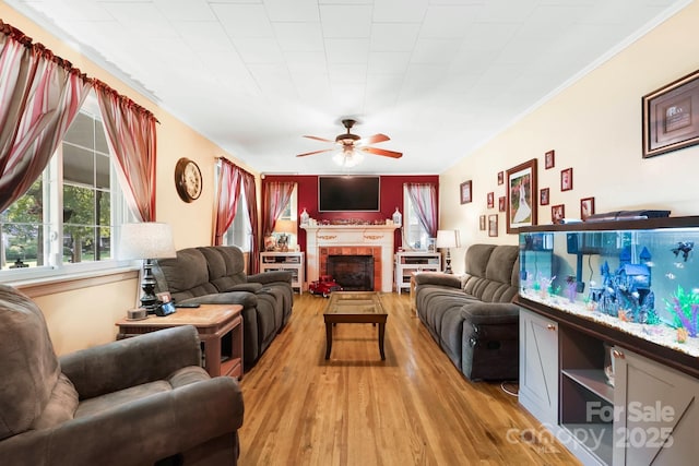 1104 Pump Station Rd, Kannapolis, NC 28081 - living area with ceiling fan, light wood finished floors, and a brick fireplace