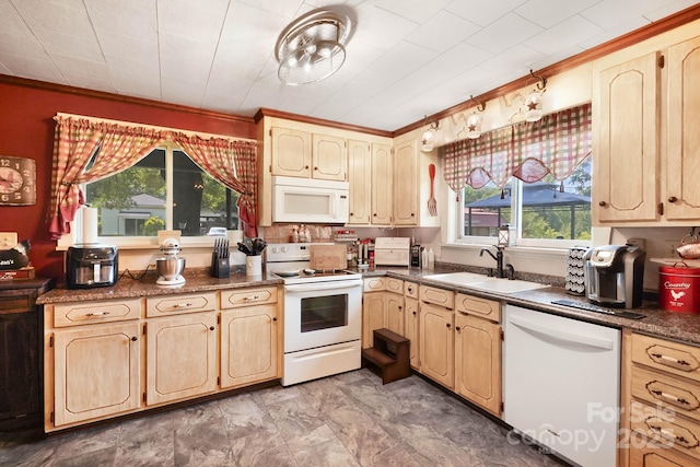 1104 Pump Station Rd, Kannapolis, NC 28081 - kitchen featuring white appliances, healthy amount of natural light, dark countertops, ornamental molding, and light brown cabinetry