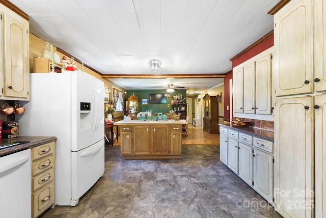 1104 Pump Station Rd, Kannapolis, NC 28081 - kitchen featuring white appliances, dark countertops, a center island, and a ceiling fan
