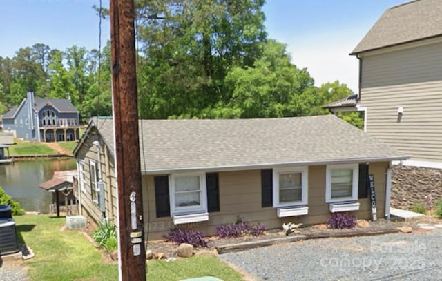 690 Lake Head Rd Unit 132, Norwood, NC 28128 - view of front of property featuring roof with shingles, a water view, and a front yard