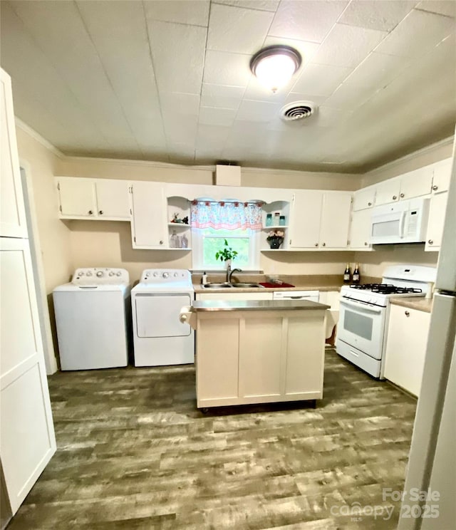 3702 Crawford St, Gastonia, NC 28052 - kitchen with washing machine and dryer, white appliances, white cabinets, open shelves, and light countertops