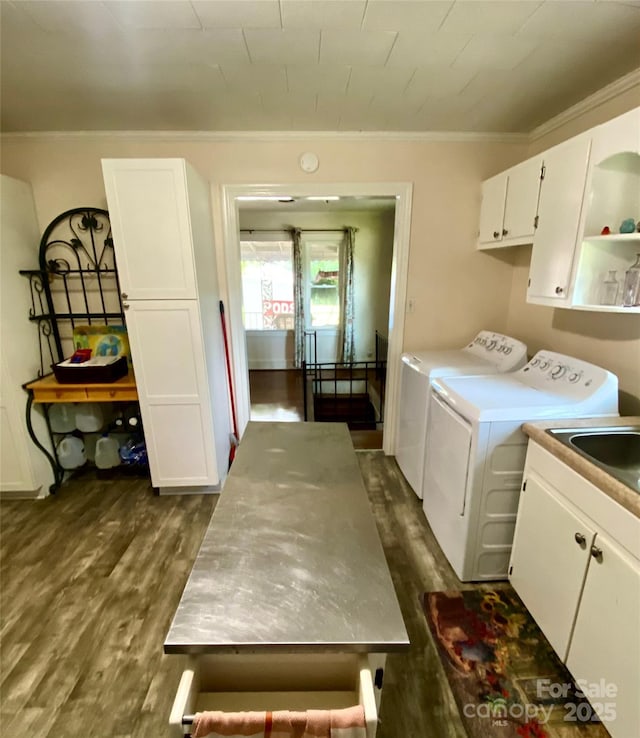 3702 Crawford St, Gastonia, NC 28052 - laundry room with cabinet space, washer and dryer, dark wood-type flooring, and crown molding