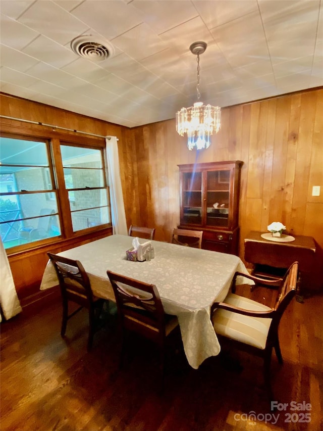 3702 Crawford St, Gastonia, NC 28052 - dining space featuring wood walls, wood finished floors, and a chandelier