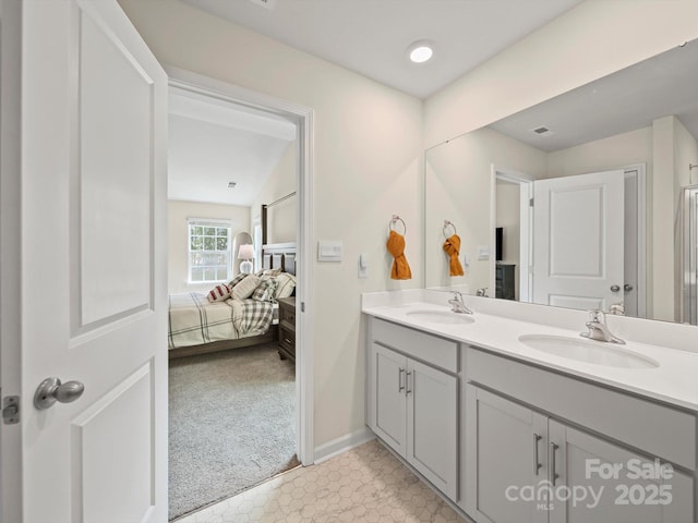 404 Saddlebred Ln, Locust, NC 28097 - ensuite bathroom featuring double vanity and baseboards