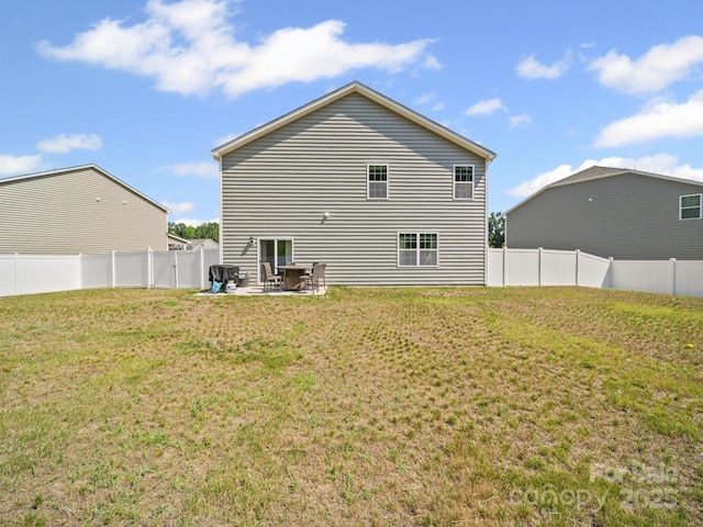 404 Saddlebred Ln, Locust, NC 28097 - rear view of property with a fenced backyard and a patio area