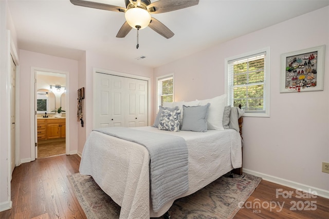 4919 Rehobeth Rd, Waxhaw, NC 28173 - bedroom featuring wood finished floors, a closet, ensuite bathroom, and a ceiling fan