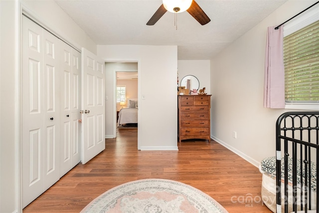4919 Rehobeth Rd, Waxhaw, NC 28173 - bedroom featuring wood finished floors, a closet, and a ceiling fan