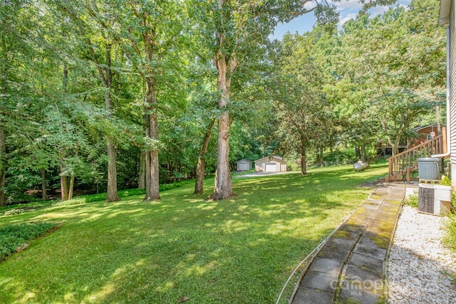 4919 Rehobeth Rd, Waxhaw, NC 28173 - view of green lawn featuring stairs, an outdoor structure, and a garage