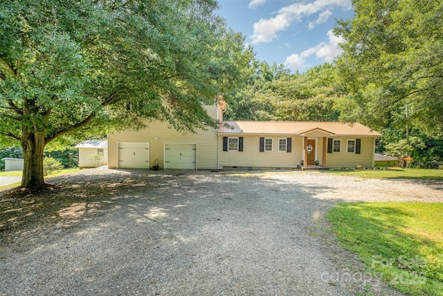4919 Rehobeth Rd, Waxhaw, NC 28173 - view of front of house with gravel driveway, a garage, a metal roof, a chimney, and crawl space