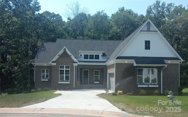 2076 Landry Ln Unit 232, Rock Hill, SC 29732 - view of front of property with a front lawn, driveway, brick siding, an attached garage, and board and batten siding