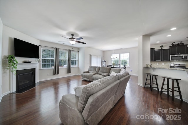 248 Catoctin Rd, Rock Hill, SC 29732 - living area with dark wood-type flooring, a ceiling fan, a fireplace with flush hearth, and recessed lighting