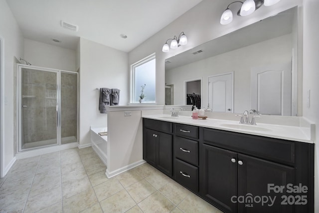 248 Catoctin Rd, Rock Hill, SC 29732 - bathroom with a shower stall, a bath, double vanity, and tile patterned flooring
