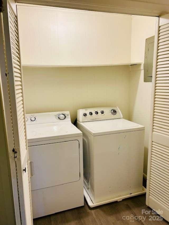 2660 Tiffany St, Conover, NC 28613 - laundry area with washing machine and dryer, dark wood-style flooring, and electric panel