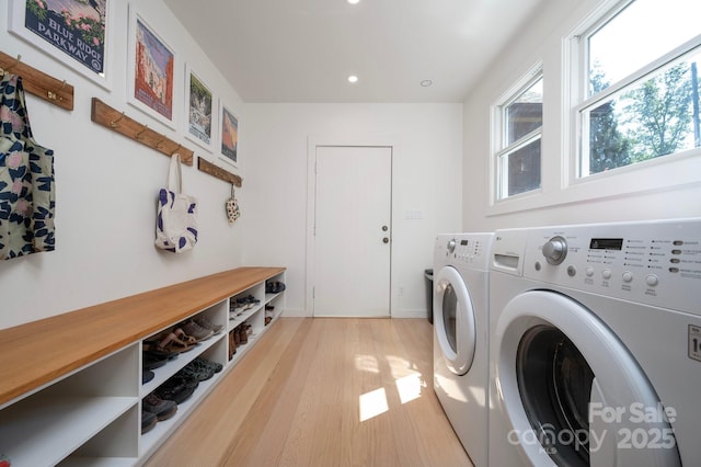 136 Graveyard Rd, Fairview, NC 28730 - laundry room featuring washing machine and clothes dryer, light wood-style floors, and recessed lighting