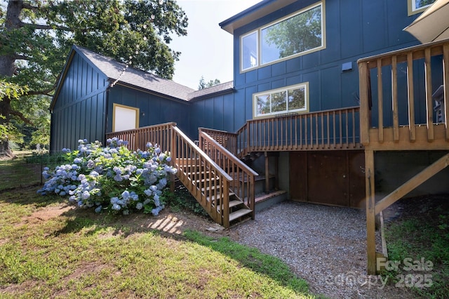 136 Graveyard Rd, Fairview, NC 28730 - back of property with board and batten siding, a deck, stairway, and a shingled roof