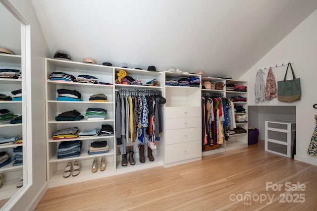 136 Graveyard Rd, Fairview, NC 28730 - walk in closet featuring vaulted ceiling and wood finished floors