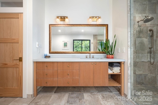 136 Graveyard Rd, Fairview, NC 28730 - bathroom with vanity, tiled shower, stone tile flooring, and recessed lighting