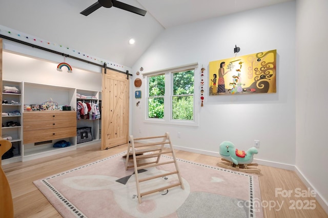 136 Graveyard Rd, Fairview, NC 28730 - workout room with a ceiling fan, wood finished floors, a barn door, lofted ceiling, and recessed lighting