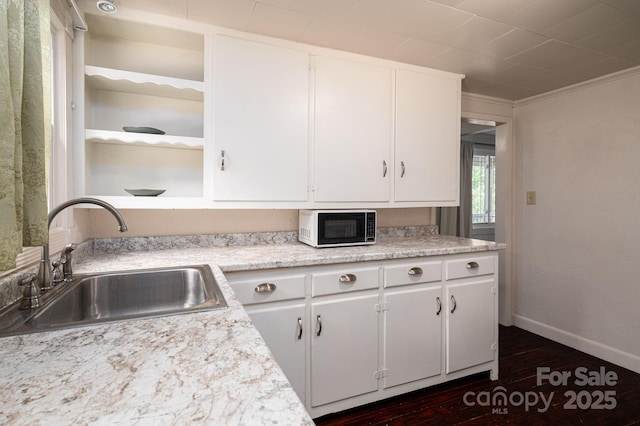 2420 Timberland Hills Dr, Newton, NC 28658 - kitchen with dark wood finished floors, white cabinetry, light countertops, and open shelves