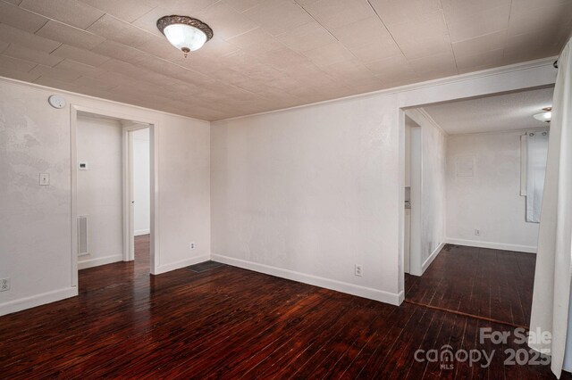 2420 Timberland Hills Dr, Newton, NC 28658 - empty room featuring hardwood / wood-style flooring, ornamental molding, and a smoke detector