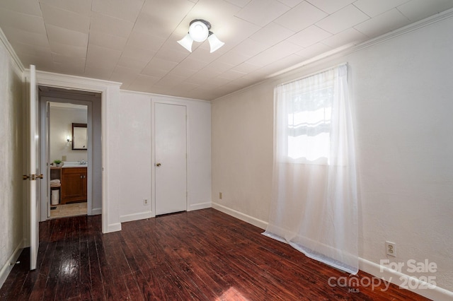 2420 Timberland Hills Dr, Newton, NC 28658 - unfurnished bedroom featuring ornamental molding and dark wood-type flooring