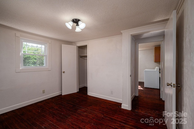 2420 Timberland Hills Dr, Newton, NC 28658 - unfurnished bedroom with washer / clothes dryer, dark wood-type flooring, ornamental molding, a textured ceiling, and a closet