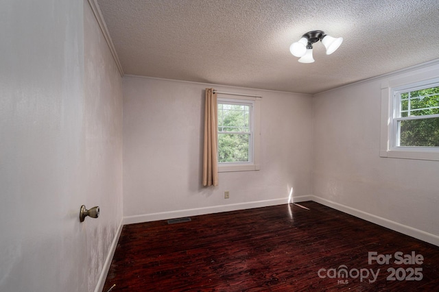 2420 Timberland Hills Dr, Newton, NC 28658 - spare room with a textured ceiling, dark wood-style floors, and crown molding